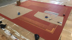 Load image into Gallery viewer, A production photo of Autumn Leaves Floorcloth #8.  This is a rare pattern that is made from the outside in vs. the inside out.