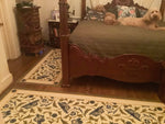 Load image into Gallery viewer, This is an image of this floorcloth installed in a bedroom, next to another one of three floorcloths in this room, with the same pattern, but different shapes, to offer maximum floor coverage.