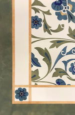 Load image into Gallery viewer, A close-up image of the corner of this floorcloth with an all-ver floral pattern.
