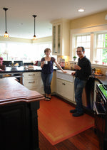 Load image into Gallery viewer, An in-situ photo of Autumn Leaves Floorcloth #1 installed in a kitchen.