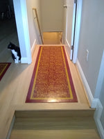 Load image into Gallery viewer, An in-situ shot of this highly patterned and boldly colored floorcloth in its clean, modern surroundings.
