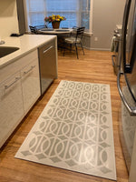 Load image into Gallery viewer, Another in-situ image of the Circle & Line floorcloth.