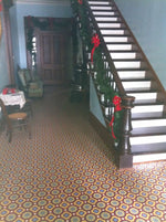 Load image into Gallery viewer, An in-situ image of Field House Floorcloth #3, installed wall-to-wall at the Starr Family Home.