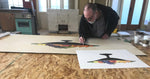 Load image into Gallery viewer, The artist at work on the Fruit Bowl Floorcloth.