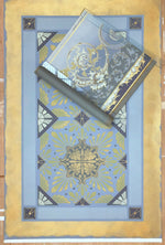 Load image into Gallery viewer, This image shows this floorcloth, based on a Christopher Dresser pattern, with it's palette inspiration, a piece of wallpaper, c. 1880, lying on top.