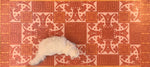 Load image into Gallery viewer, A full image of our Greek Key Floorcloth #3 with Opal providing scale.