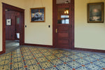 Load image into Gallery viewer, In-situ image of this floorcloth based on a Christopher Dresser design with  and overall diamond effect and deco elements.  Photo by Sally Painter.