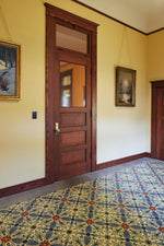 Load image into Gallery viewer, In-situ image of this floorcloth based on a Christopher Dresser design with  and overall diamond effect and deco elements. Photo by Sally Painter.