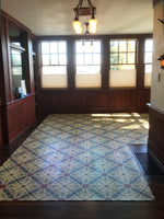 Load image into Gallery viewer, In-situ image of this floorcloth based on a Christopher Dresser design with an overall diamond effect and deco elements.