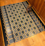 Load image into Gallery viewer, Honeycomb Floorcloth #2 in-situ, with the mighty Rupert providing scale.