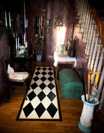 Load image into Gallery viewer, This Harlequin Floorcloth gracing the hall of this lovely 1880 home with its dramatic period wallpaper.