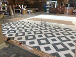 Load image into Gallery viewer, Production image of the first of 11 stencils passes required to create the design for Melrose Floorcloth #1.