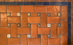 Load image into Gallery viewer, A close up of the actual Mexican tile that inspired this floorcloth design.