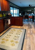 Load image into Gallery viewer, In-situ image of Poppy Floorcloth #3 with view into dining area.
