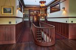 Load image into Gallery viewer, In-situ image of this floorcloth based on a pattern from Christopher Dresser's "Studies in Design" c. 1875.  This floorcloth was shaped to fit around a stairwell. Photo by Sally Painter.