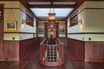 Load image into Gallery viewer, In-situ image of this floorcloth based on a pattern from Christopher Dresser's "Studies in Design" c. 1875.  This floorcloth was shaped to fit around a stairwell. Photo by Sally Painter.