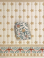 Load image into Gallery viewer, William Morris's "Fruit" wallpaper sample against the StarFlower #6 floorcloth.  The clients specified all of the colors using the paper as a guide and choosing paint colors from the Valspar and Benjamin Moore palettes.