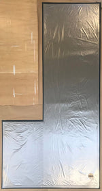 Load image into Gallery viewer, The backside of this shaped floorcloth which has a two inch hem with carpet padding placed in the interior and then covered with a waterproof fabric.