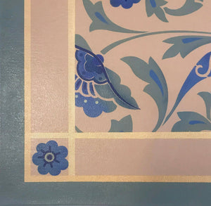 Close up image of floorcloth corner with an all over floral pattern, based on a Christopher Dresser pattern.