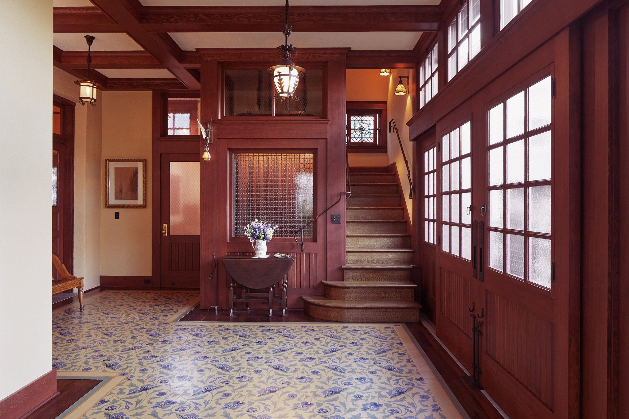 In-situ image of a shaped floorcloth, made to perfectly fit this space. The design is an all over floral pattern by Christopher Dresser. Photo by Sally Painter.