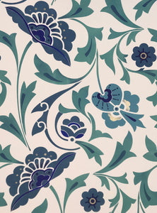 A close up of the all-over-floral pattern on this floorcloth with its whimsical flowers and leaves and lovely hues of blues and green.  