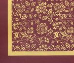 Load image into Gallery viewer, The corner of this floorcloth with a one inch ochre band and a two inch band of the burgundy background color.
