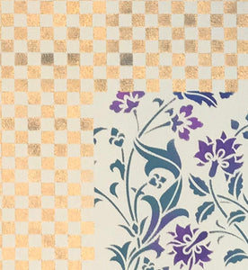 A close up image of the corner of this floorcloth with a checkerboard border and floral interior.