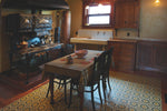 Load image into Gallery viewer, An in-situ image of Field House Floorcloth #2 in its Victorian kitchen.
