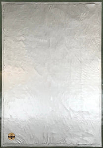 The backside of this floorcloth, showing the waterproof vinyl layer which is attached to the hem, covering a layer of carpet padding.