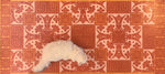 Load image into Gallery viewer, A full image of our Greek Key Floorcloth #3 with Opal providing scale.

