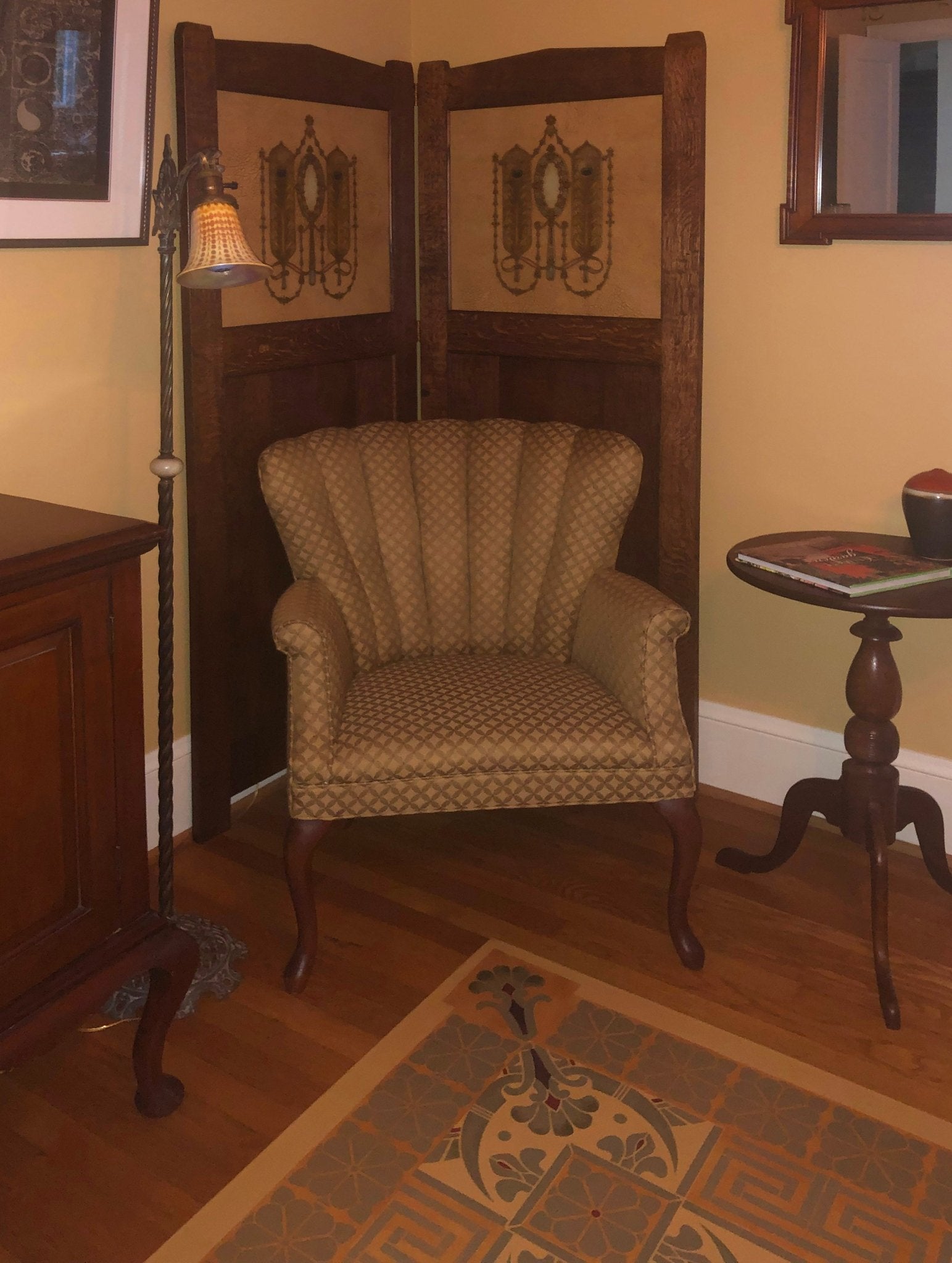 An in-situ image of Greek Key Floorcloth #4 showing the flute-backed chair which is complimented by the floorcloth corner motif and the shape of the corner picks up on the frame of the wall mirror. 