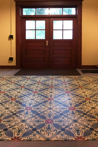 In-situ image of this floorcloth based on a Christopher Dresser design with  and overall diamond effect and deco elements.