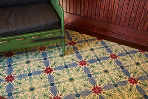In-situ image of this floorcloth based on a Christopher Dresser design with an overall diamond effect and deco elements. Photo by Sally Painter.