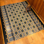 Load image into Gallery viewer, Honeycomb Floorcloth #2 in-situ, with the mighty Rupert providing scale. 
