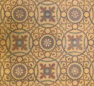 A close up of this intricate, mosaic-style linoleum pattern with interlocking circles, scrolls and floral elements.  This pattern has been printed on treated canvas (vs. stenciled like all of our other floorcloths.)  