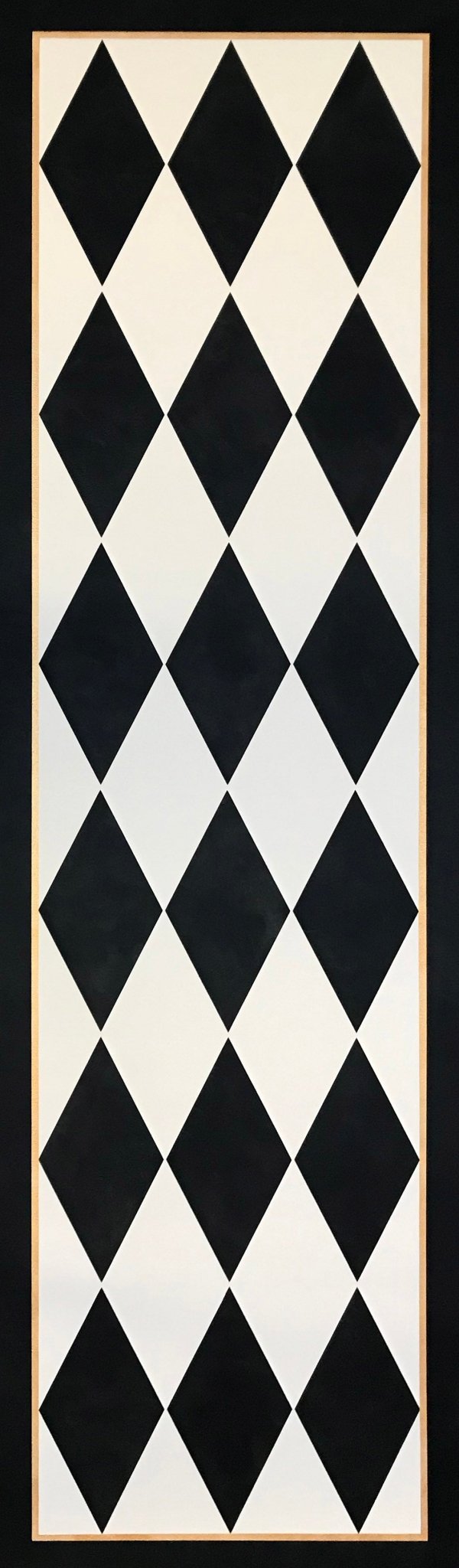 The full image of this traditional floorcloth which employs a classic harlequin pattern of elongated diamonds in cream and black. 