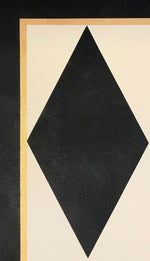 Load image into Gallery viewer, A close up of a corner of this floorcloth showing a full black diamond and border comprised of a thin gold accent line and a black band.
