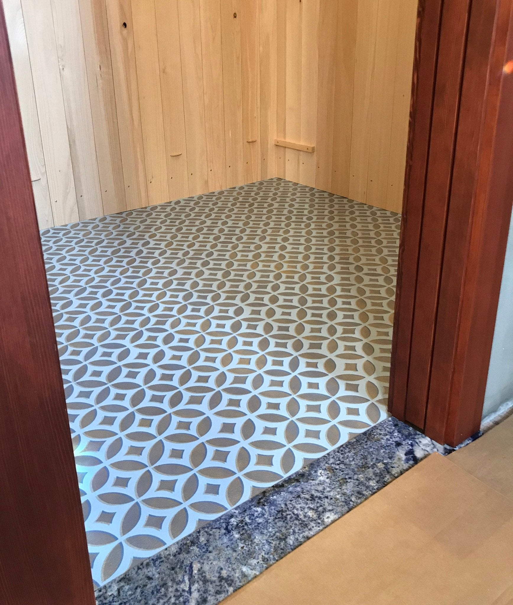 In-situ image of this floorcloth, installed wall-to-wall in a walk in closet.
