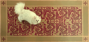 A full image of our Lion & Shield Floorcloth #4 with Opal providing scale.