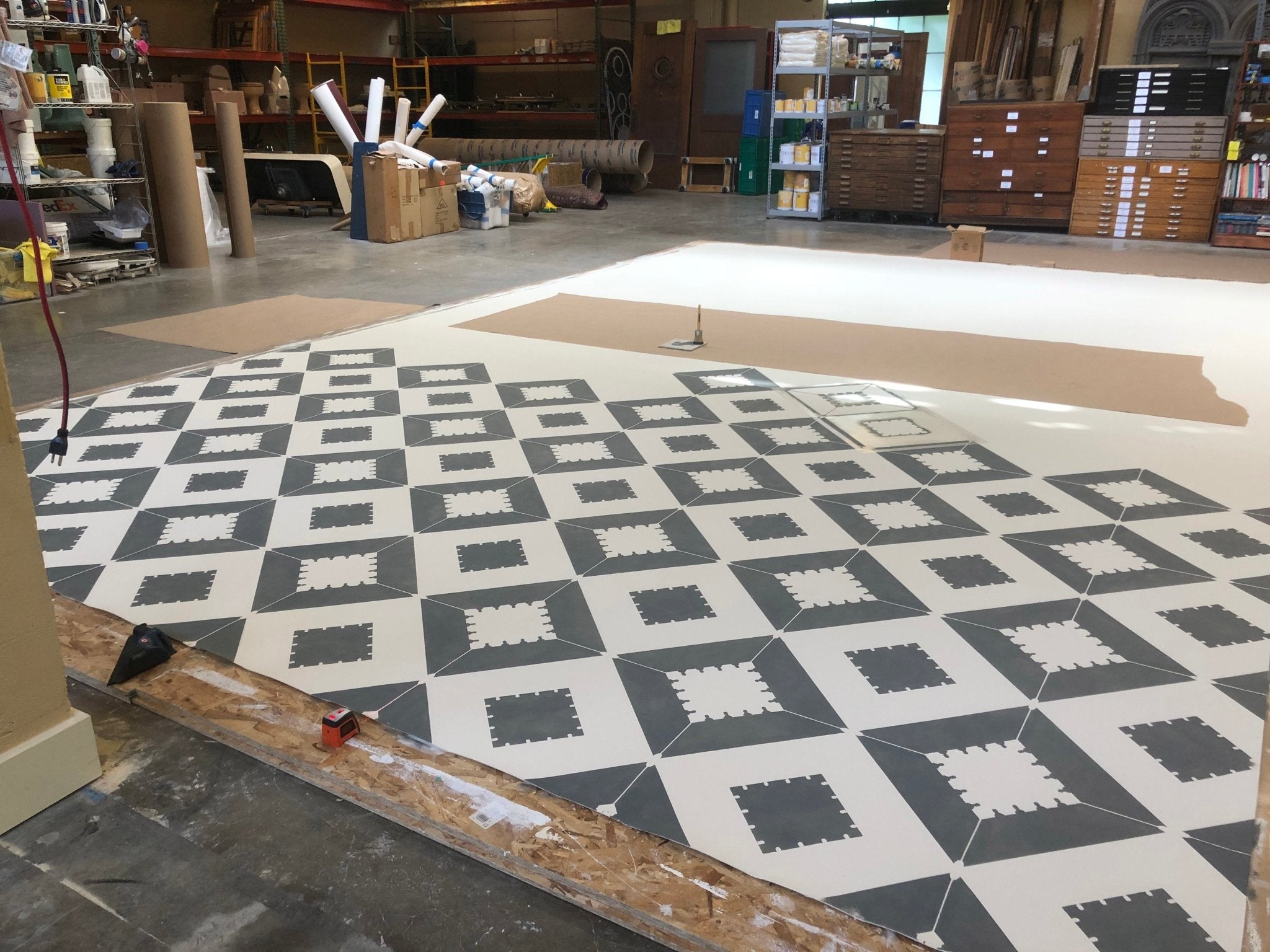 Production image of the first of 11 stencils passes required to create the design for Melrose Floorcloth #1.