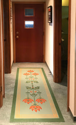 Load image into Gallery viewer, An in situ photo of Poppy Floorcloth #2 at the entrance to this mid century modern house.
