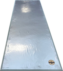The backside of this floorcloth, which has a layer of carpet padding under a waterproof vinyl fabric, which is adhered to the hem.