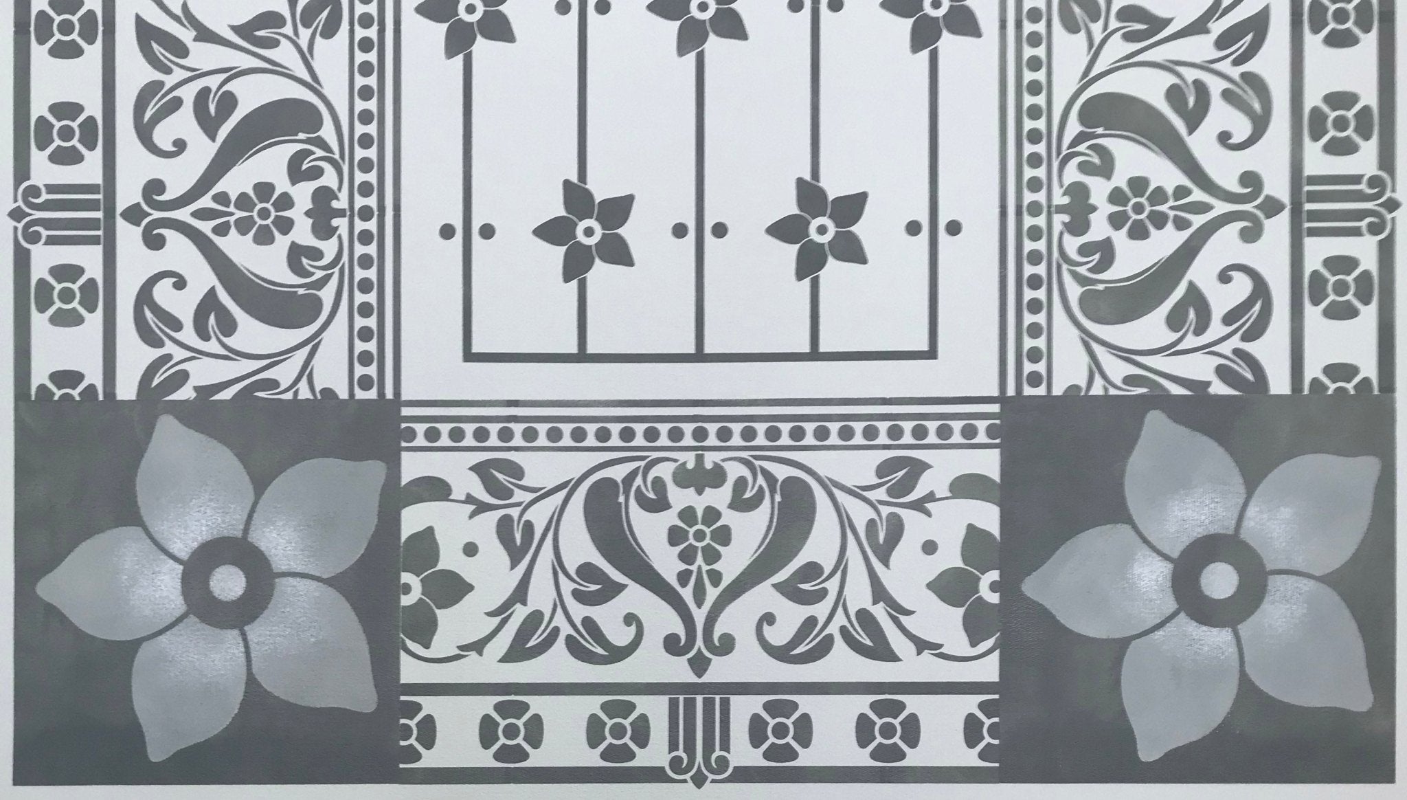 A close up of the corners and border for this floorcloth based on a Dresser design.