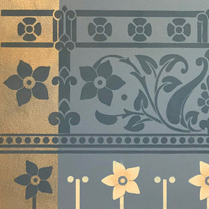 A close-up of the corner of this floorcloth with its stylized floral motifs.