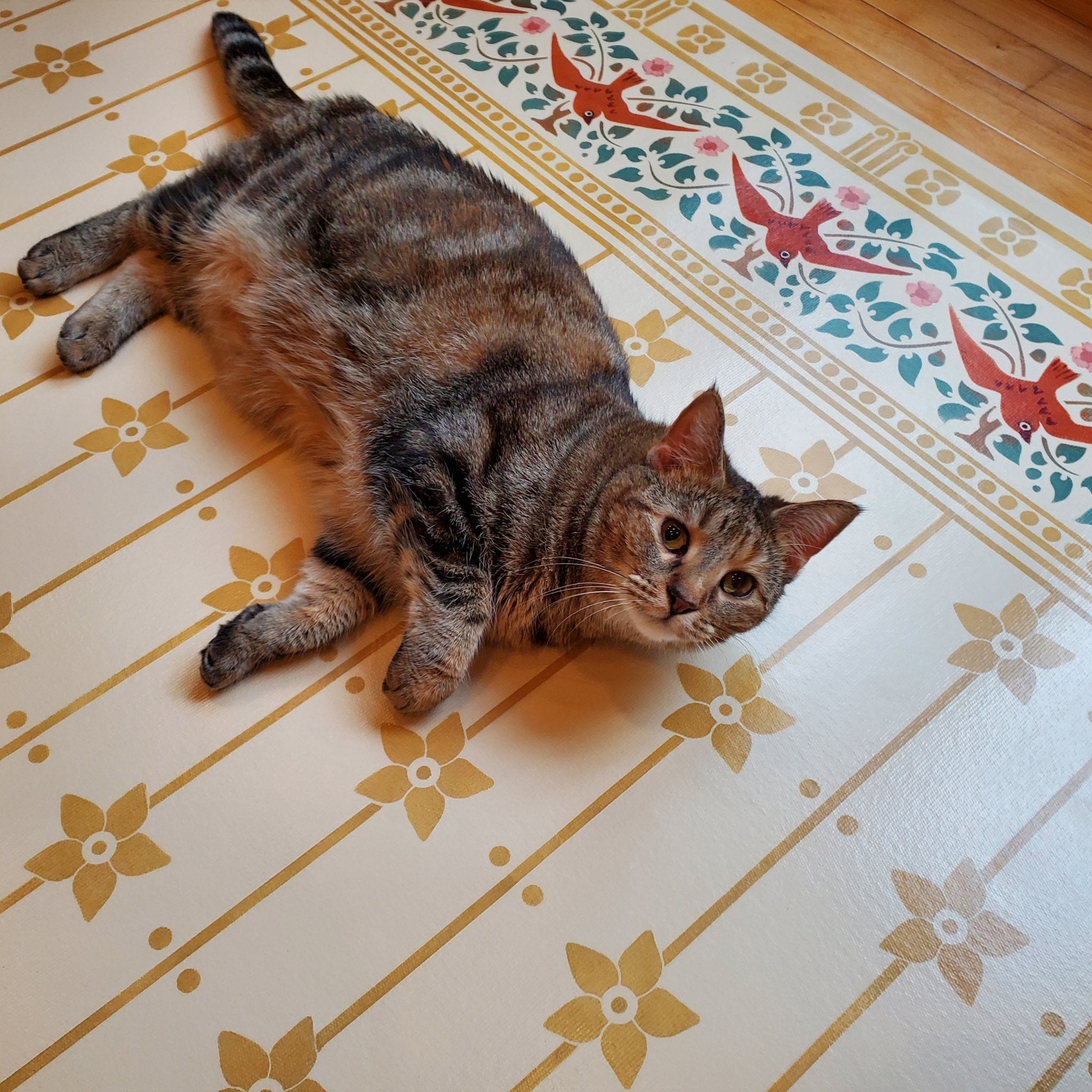 Jade The Cat getting comfortable on StarFlower Floorcloth #6!