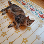 Load image into Gallery viewer, Jade The Cat getting comfortable on StarFlower Floorcloth #6!
