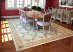 Load image into Gallery viewer, In-situ image of this custom floorcloth with the buffet that was the inspiration for its hand-painted corner motifs.
