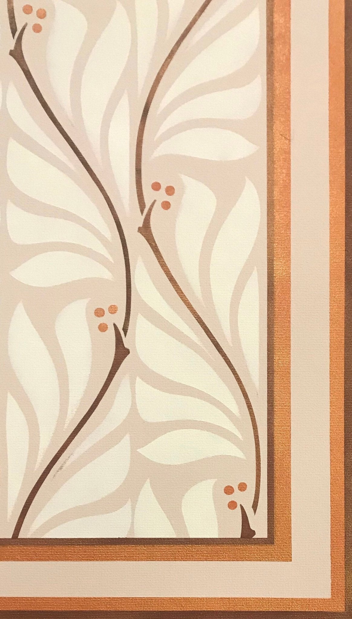 A close up of the corner of this floorcloth, with simple banding around the center motifs of undulating vines and berries.