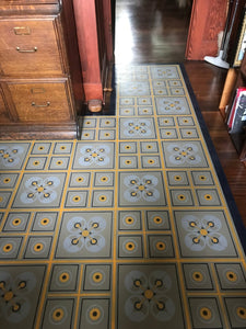 In-situ image of this shaped floorcloth based on a rare geometric design by Christopher Dresser.